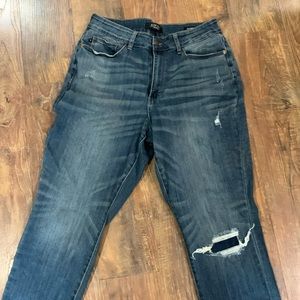 Judy Blue denim. Some distressing BUT it’s patched (came this way).